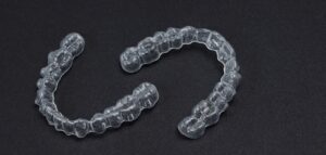Patient smiling with Invisalign in Fitzrovia for straighter teeth