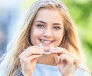 Patient smiling with Invisalign in Fitzrovia for straighter teeth